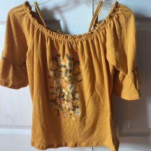 golden cold shoulder top with floral design